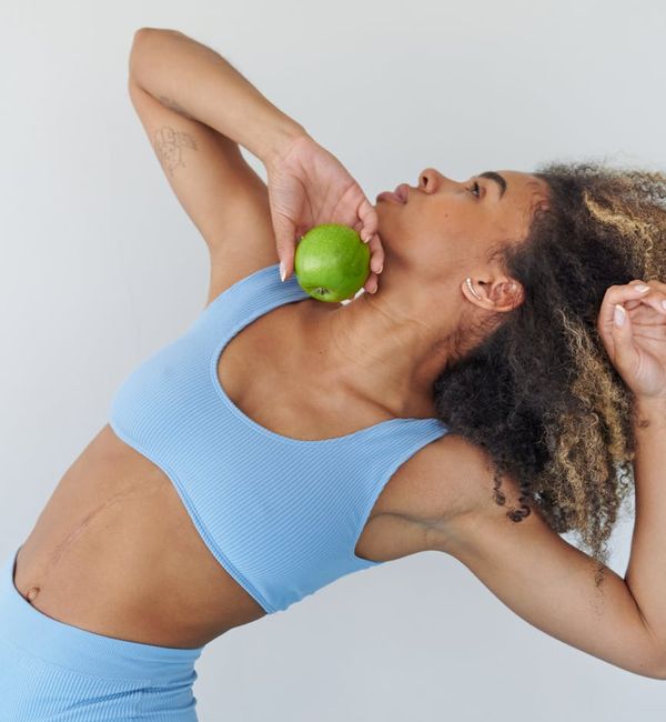 Athlete showing flexibility and strength in a dynamic pose.